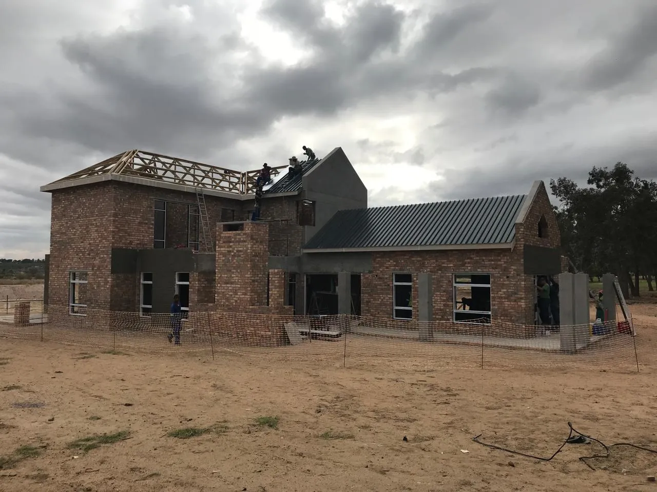 Renov8 team fixing roof sheeting on a Devonvale residence
